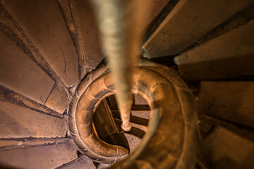 Spiral staircase with a rope instead of a hand rail in an old half timbered house Strasbourg,...