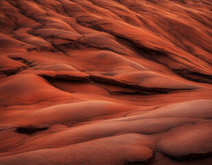 Fototapeta na wymiar Red-brown stone grunge background with dark mountains texture