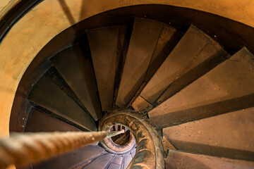 Spiral staircase with a rope instead of a hand rail in an old half timbered house Strasbourg, Alsace, France