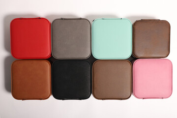 Diffirent colors leather jewelry box. Concept shot, top view. Custom background jewelry box view. Jewelry box and accessories.