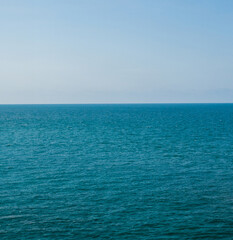 Obraz premium Vertical front viewpoint Leam Ya mountain landscape sea sky blue clear background no cloud day time look calm summer Nature tropical beautiful pacific ocean wave water nobody travel exotic horizon.