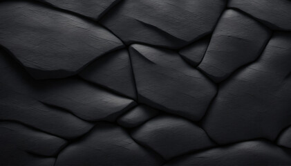 Close-up texture of dark volcanic rock wall. Rough and voluminous basalt granite surface.