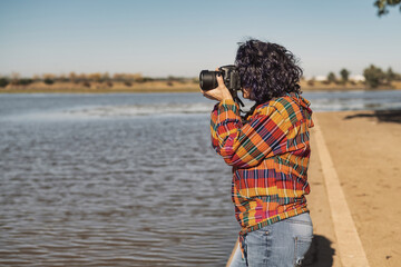 A Hipster Female With Digital Camera Taking Photos Outdoors. Outdoor Hobbies And Travel Concept.