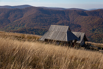 View of the Bieszczady Mountains from Połonina Wetlińska. Barn in the mountains during autumn sesion. 