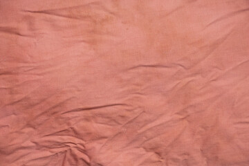 Pink old dirty crumpled fabric with stains