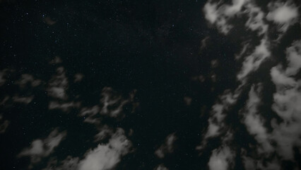 dark night sky with clouds and stars, space as background