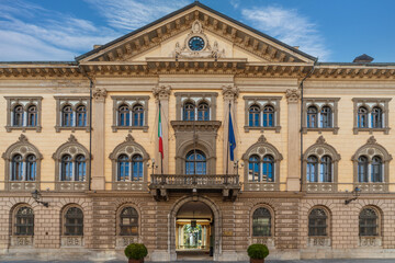 Fototapeta na wymiar Cuneo, Piedmont, Italy - December 19, 2023: The facade of building Prefecture Cuneo (1882) in street Rome, majestic neoclassical building