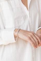 Woman wearing diamond tennis bracelet