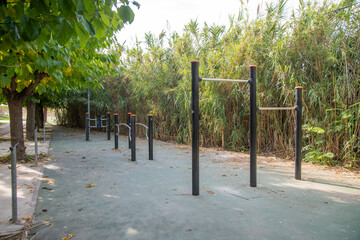 Public Fitness Park with Bar Racks and Natural Surroundings