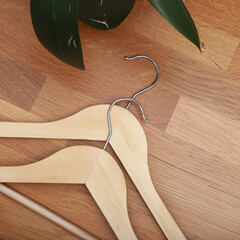 Wooden clothes hangers. Concept shot, top view. Custom background, view of wooden clothes hangers.