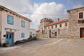 Fototapeta na wymiar Lindar, Pazin, Istria, Croatia: the village square with an ancient palace with tower