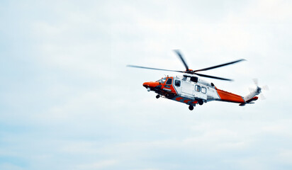 Search And Rescue Operations At Sea. Red Rescue Helicopter. Emergency Response Team. Emergency Accident On Board Merchant Ship. Helicopter Training  And Simulation Ship In Distress
