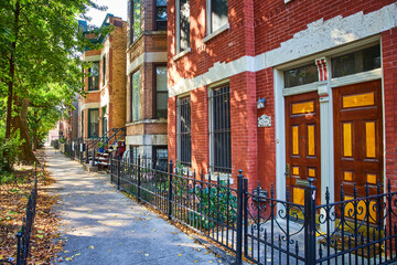 Red brick house, apartment building along inner city neighborhood, mortgage, refinance, rent - obrazy, fototapety, plakaty