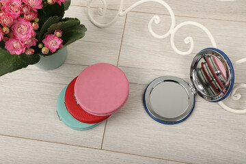 Leather Round pocket makeup mirror in different colors. Concept shot, top view. Custom background,...