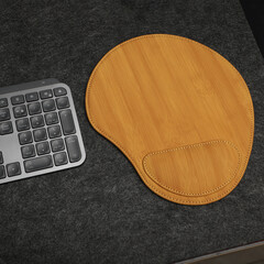 Leather mousepads in bamboo colors. Concept shot, top view. Custom background, leather mousepad. Free space for text.