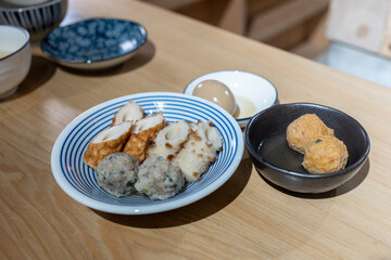 Japanese dumplings and fish ball on a plate