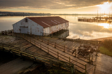 Old aged Semiahmoo Cannery Building at Tounge Point on Semiahmoo Spit in Blaine, WA.  Salmon canning was once a roaring business here on the Semiahmoo Spit that brought many businesses to the spit.