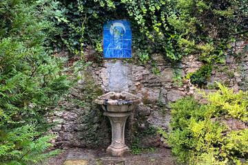 Fountain with blue glass in the park, Rome, Italy.