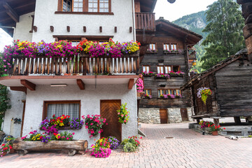 Fototapeta na wymiar Switzerland Chalets with Flowers