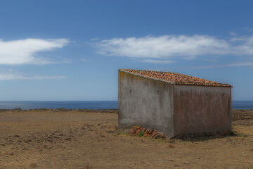 abandoned hut on the beach