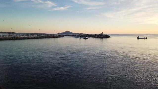 Loreto Baja Marina fisherman throwing nets for bait fish early in the morning