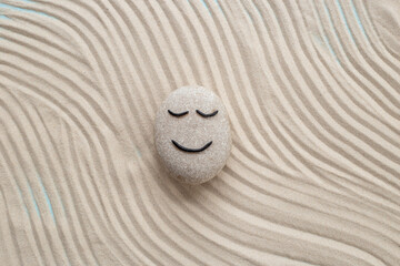 Obraz premium Maditation and relaxation with zen stone calm face. Calmness and harmony background