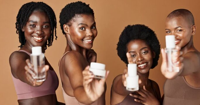 Happy black woman, skincare and beauty products for tone or foundation against a brown studio background. Group portrait of African female people or model smile together with skin makeup on mockup