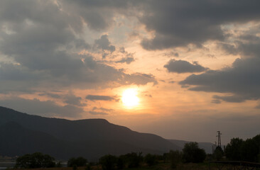 Sunset over the town of Sarnitsa, located in the Western Rhodope Mountains near the Dospat Reservoir.