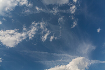 Naklejka na ściany i meble Cirrus cloudscape on blue sky. Majestic Clouds.