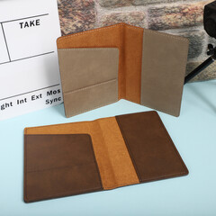 Leather passport wallet in different colors. Concept shot, top view. Custom background, Vacation and tourism concept. Free space for text. Stylish accessory for travelling