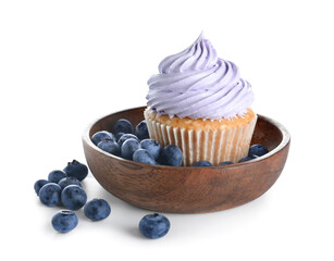 Bowl of tasty cupcake with blueberries on white background