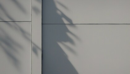 Shadow of palm leaf on the wall of a modern office building.