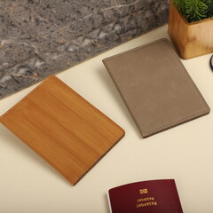 Leather passport wallet in different colors. Concept shot, top view. Custom background, Vacation and tourism concept. Free space for text. Stylish accessory for travelling