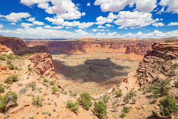 Fototapeta na wymiar Panoramic view from of Aztec Butte of the surrounding canyon, vegetation and mesa of Canyonlands Nation Park in the arid, desert Utah environment during spring 