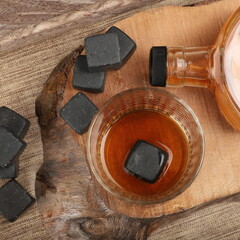 Whiskey cooler set gray soapstone stones close up. Concept shot, top view. Cooling cube whiskey stone concept. Gray whiskey stone.