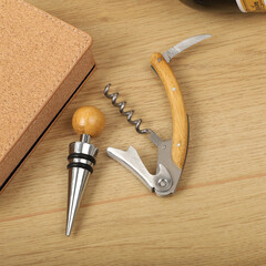 Wine opener set in leather box. Colorful leather boxes. Wine opener and cork. Close-up, top view,...