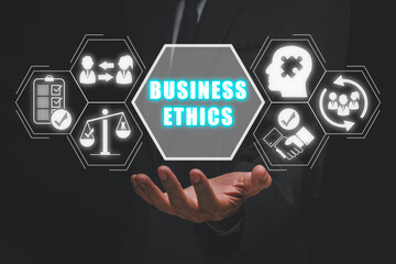 Business Ethics concept, Businessman hand holding business Ethics icon on virtual screen, Ethical...