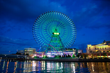 A night illuminated ferris wheel in Yokohama wide shot