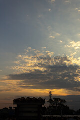 Sunset in the city. Clouds in the sky at sunset.