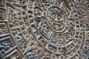 Ancient Mayan Calendar or Aztec calendar with rough relief surface outdoors