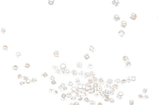 Fashion Silver gold bead cube with beautiful work detail is value. Luxury silver copper metal bead sequin is fashion trend and fly in air. Black background isolated selective focus blur