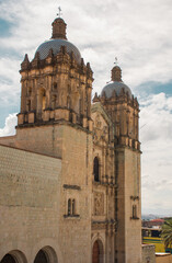 Fototapeta na wymiar Beautiful front view of the Santo Domingo cathedral in downtown Oaxaca City.