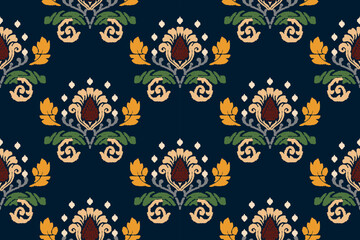 Ikat floral paisley embroidery on blue background.Ikat ethnic oriental pattern traditional.Aztec style abstract vector illustration.Seamless pattern in tribal, folk 