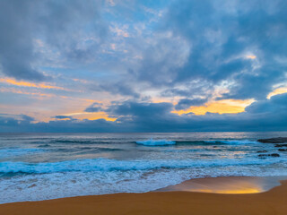 Naklejka na ściany i meble Northern Beaches Sunrise at the seaside with rain clouds