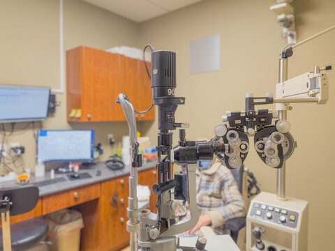 Ophthalmic equipment is used to diagnose a patient in a doctor's office