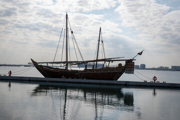 Fototapeta na wymiar Traditional boats called Dhows are anchored in the old Doha port