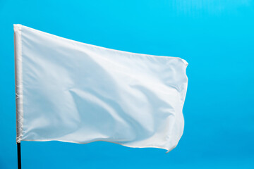 White flag waving on blue background