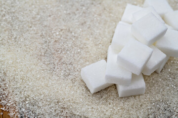 Sugar cubes on top of granulated sugar