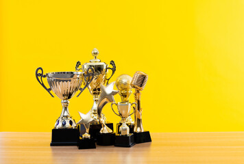 Group of trophies on wooden table