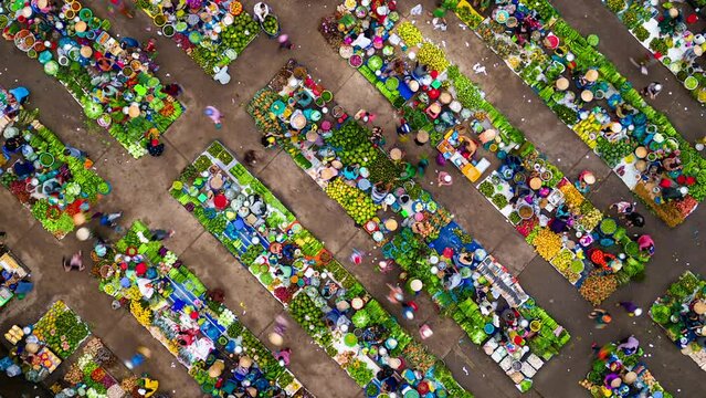Top view timelapse of colorful local outdoor farmers market in rural Vietnam.
